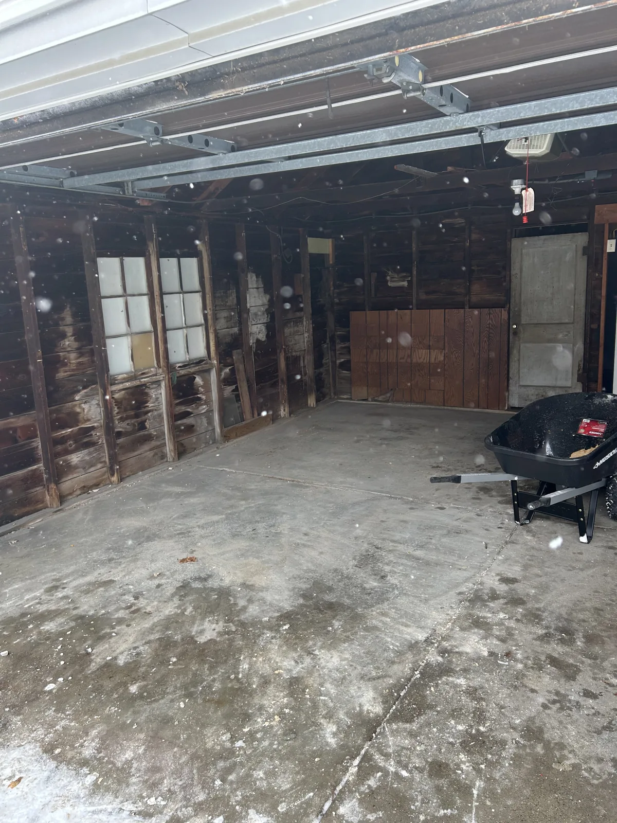 The same garage bay cleared to bare concrete after removal