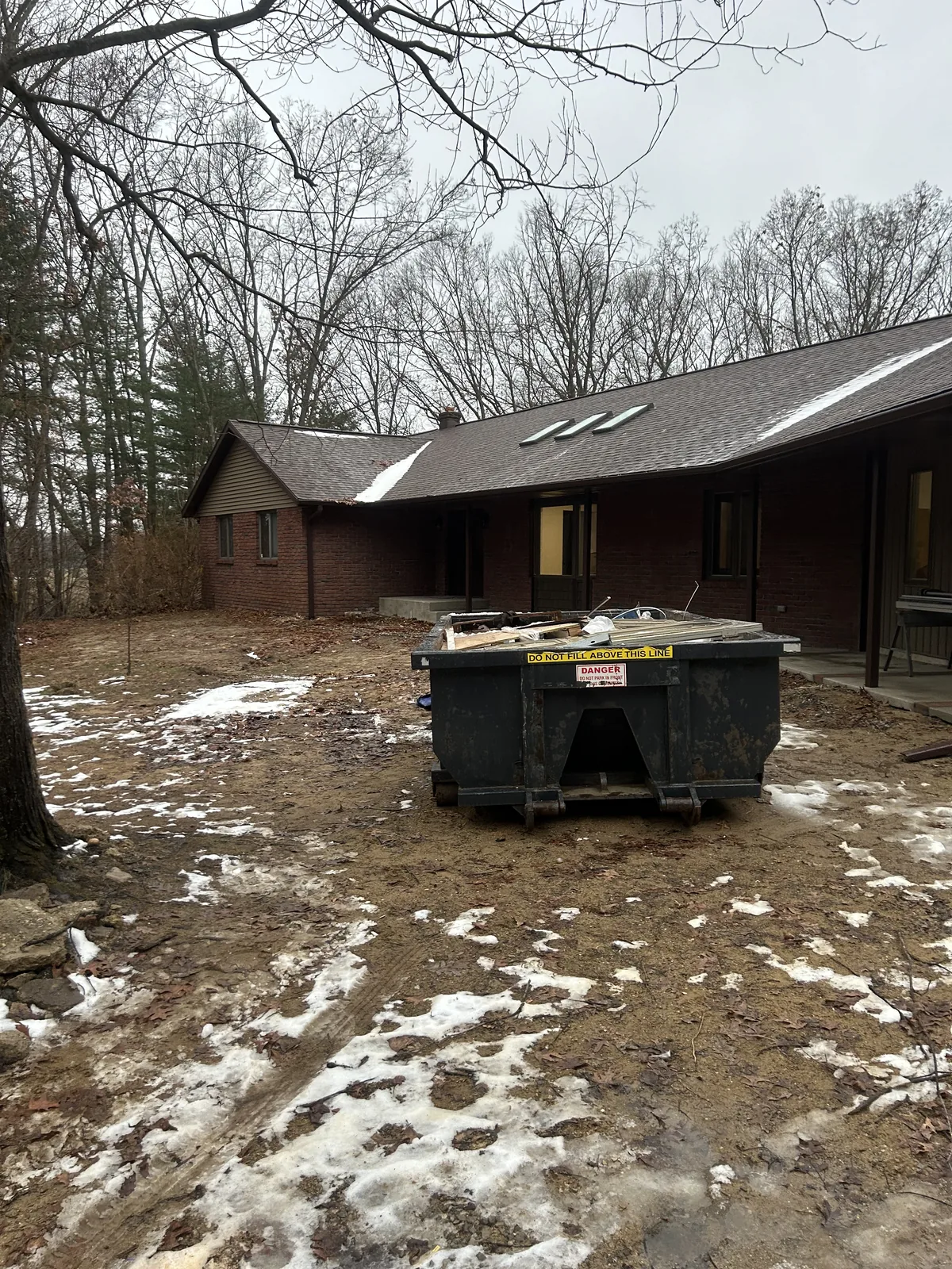 Dumpster delivered and set on a job site